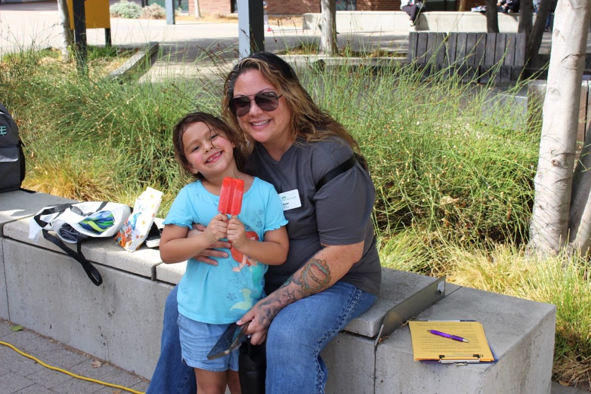 Courtesy of Kerry Surman.
DVC student Monique Cortes and her 5-year-old daughter Mia enjoyed ice cream and bouncy houses at an event promoting services for student parents.